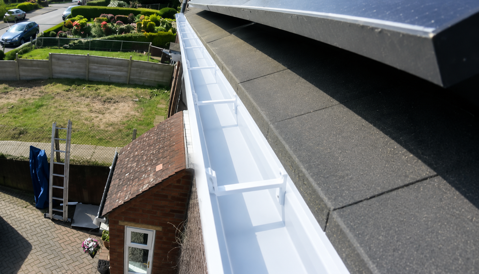After professional gutter cleaning — channel fully cleared and flowing freely